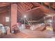 Spacious unfinished attic shows wooden plank flooring, exposed beams and brick chimney at 655 E Pelham Ne Rd, Atlanta, GA 30324