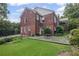 Brick home with a lush backyard and a charming patio area at 655 E Pelham Ne Rd, Atlanta, GA 30324