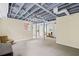 Spacious unfinished basement with painted ceilings, brick walls, with a fireplace at 655 E Pelham Ne Rd, Atlanta, GA 30324