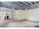 Unfinished basement features painted ceilings, with carpet flooring and a decorative fireplace at 655 E Pelham Ne Rd, Atlanta, GA 30324