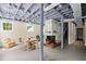 Spacious finished basement with exposed ceiling and brick fireplace at 655 E Pelham Ne Rd, Atlanta, GA 30324