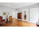 Light-filled bedroom with hardwood floors and antique furniture at 655 E Pelham Ne Rd, Atlanta, GA 30324