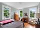 Bright bedroom with large windows and hardwood floors at 655 E Pelham Ne Rd, Atlanta, GA 30324