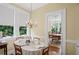 Cozy dining nook with natural light and chandelier at 655 E Pelham Ne Rd, Atlanta, GA 30324