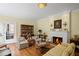 Cozy living room with fireplace, wood floors, and elegant decor at 655 E Pelham Ne Rd, Atlanta, GA 30324