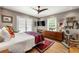 Bedroom with a ceiling fan, hardwood floors, and a quirky cat tree at 1141 Moorestown Cir, Decatur, GA 30033