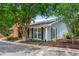 Exterior of a cozy home with light blue siding, black shutters, and mature trees at 1141 Moorestown Cir, Decatur, GA 30033