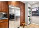 Stylish kitchen with stainless steel appliances, wooden cabinets, and a convenient washer/dryer at 1141 Moorestown Cir, Decatur, GA 30033