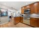 Updated kitchen with stainless steel appliances, wooden cabinetry, and open view to living area at 1141 Moorestown Cir, Decatur, GA 30033