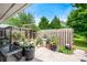 Charming outdoor patio with decorative plants and flowers, enclosed by a wooden fence at 1141 Moorestown Cir, Decatur, GA 30033