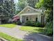 Charming bungalow with mature landscaping and inviting front porch and traditional architectural details at 1231 Mansfield Ne Ave, Atlanta, GA 30307