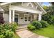 Charming front porch with swing and well-maintained landscaping leading to the entrance at 1231 Mansfield Ne Ave, Atlanta, GA 30307