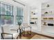 Home office area featuring built-in shelving and comfortable seating arrangement at 1231 Mansfield Ne Ave, Atlanta, GA 30307