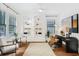 Bright home office with built-in shelving, contemporary decor, and hardwood floors at 1231 Mansfield Ne Ave, Atlanta, GA 30307