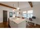 Beautiful kitchen with an island with sink and office work station, hardwood floors, and windows at 1231 Mansfield Ne Ave, Atlanta, GA 30307