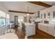 Beautiful open kitchen with island with seating, wood beams, stainless steel appliances, and hardwood floors at 1231 Mansfield Ne Ave, Atlanta, GA 30307