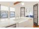 Bright kitchen featuring an island sink, stainless steel appliances, and black trimmed windows at 1231 Mansfield Ne Ave, Atlanta, GA 30307