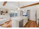 Bright kitchen featuring an island sink, stainless steel appliances, and hardwood floors at 1231 Mansfield Ne Ave, Atlanta, GA 30307