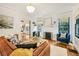 Bright living room with fireplace, hardwood floors, and comfortable seating arrangement at 1231 Mansfield Ne Ave, Atlanta, GA 30307