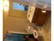 A well-lit bathroom features a classic vanity, a toilet, and a shower curtain with colorful and whimsical designs at 116 Madeline Ct, Mcdonough, GA 30253