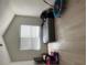 A simple bedroom features a window providing natural light, plus a bed and toys on a light wood floor at 116 Madeline Ct, Mcdonough, GA 30253