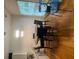 Modern dining room with hardwood floors, a contemporary chandelier, and a black round table at 116 Madeline Ct, Mcdonough, GA 30253