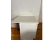 White kitchen cabinet with white countertop on hardwood floors, showing extra outlets on the wall at 116 Madeline Ct, Mcdonough, GA 30253