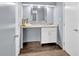 This bathroom has a vanity with granite countertop and a mirror at 122 Rue Fontaine, Lithonia, GA 30038