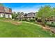 Townhouse exteriors feature landscaped lawns and sidewalks, offering a serene community setting and curb appeal at 122 Rue Fontaine, Lithonia, GA 30038