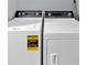 Close-up of a washing machine and dryer, highlighting their features and energy efficiency at 122 Rue Fontaine, Lithonia, GA 30038
