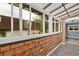 Exterior view of sunroom with wood siding at 122 Rue Fontaine, Lithonia, GA 30038