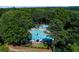 Aerial view showcasing the community pool and lush green surroundings at 2015 Towne Lake W Hls, Woodstock, GA 30189