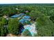 Community amenities include a swimming pool and tennis courts surrounded by trees, promising an active lifestyle at 2015 Towne Lake W Hls, Woodstock, GA 30189
