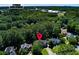 Aerial view of a house nestled among lush trees, with proximity to Etowah High School at 2015 Towne Lake W Hls, Woodstock, GA 30189