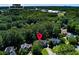 Aerial shot of home in a wooded neighborhood, near Etowah High School at 2015 Towne Lake W Hls, Woodstock, GA 30189