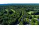 A bird's eye view shows the community with a winding street that leads to a golf course at 2015 Towne Lake W Hls, Woodstock, GA 30189