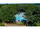 Beautiful aerial view of community pool area surrounded by lush greenery, ideal for relaxation and fun at 2015 Towne Lake W Hls, Woodstock, GA 30189