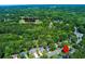 Aerial view of a home's location close to Towne Lake Hills Golf Club in a lush, green neighborhood at 2015 Towne Lake W Hls, Woodstock, GA 30189