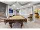 Entertaining basement features a pool table, neutral colors, and an open floor plan at 2015 Towne Lake W Hls, Woodstock, GA 30189