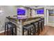 Finished basement featuring a bar with seating and TV at 2015 Towne Lake W Hls, Woodstock, GA 30189