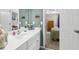 Bathroom with white cabinets and doorway to carpeted bedroom at 2015 Towne Lake W Hls, Woodstock, GA 30189
