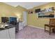 Bedroom with a desk and chair, complemented by neutral walls and carpet at 2015 Towne Lake W Hls, Woodstock, GA 30189