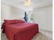 Bedroom with a large bed, a ceiling fan, carpet, and natural light from the window at 2015 Towne Lake W Hls, Woodstock, GA 30189