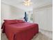 This bedroom boasts a cozy feel with a ceiling fan and a large double door closet at 2015 Towne Lake W Hls, Woodstock, GA 30189