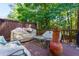 Outdoor deck with comfortable seating, covered grill, and decorative accents for relaxing or entertaining at 2015 Towne Lake W Hls, Woodstock, GA 30189