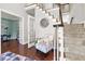 Foyer features hardwood floors, staircase, and seating area with accent chair at 2015 Towne Lake W Hls, Woodstock, GA 30189