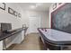 Spacious game room with air hockey table, desk, and multiple framed photos at 2015 Towne Lake W Hls, Woodstock, GA 30189
