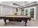 Basement game room featuring pool table with decorative legs and walk-out to backyard at 2015 Towne Lake W Hls, Woodstock, GA 30189