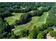 Picturesque aerial shot of the golf course and its well-manicured greens at 2015 Towne Lake W Hls, Woodstock, GA 30189