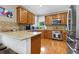 Well-equipped kitchen with stainless steel appliances, wood cabinets, and spacious countertops at 2015 Towne Lake W Hls, Woodstock, GA 30189